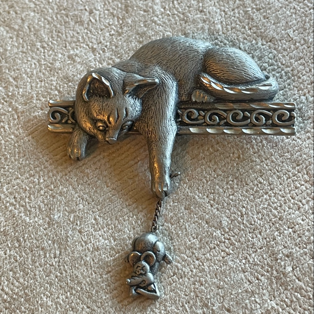 Cat reaching for mouse pin